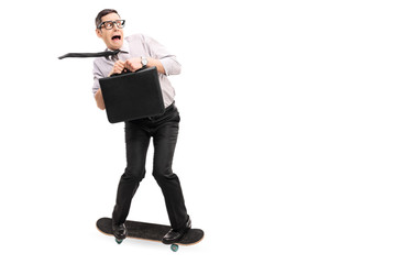 Wall Mural - Scared businessman riding a skateboard