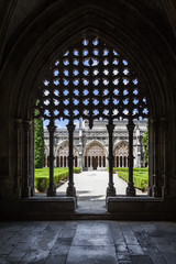 Wall Mural - Batalha, Portugal - July, 2015: Silhouette of the tracery work on the Royal Cloister of the Batalha Abbey. Masterpiece of the Gothic and Manueline art. UNESCO World Heritage Site.