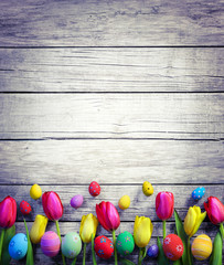 Tulips And Easter Eggs On Vintage Wooden
