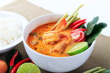 Thai Prawn Soup With Lemongrass (Tom Yum Goong) With Rice On Brown Cloth Background.