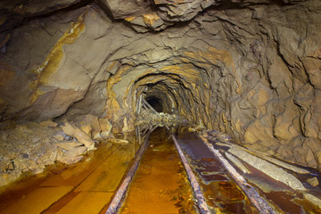 Old abandoned gold mine tunnel passage