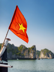 Canvas Print - Closeup view of the flag of Vietnam on ship, the Ha Long Bay