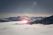Über den Wolken - Bergpanorama Tirol im Winter mit Lens flare - Kitzbüheler Alpen, Tirol, Österreich