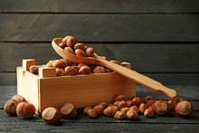 Hazelnuts In Wooden Box And Spoon On The Table, Close-up