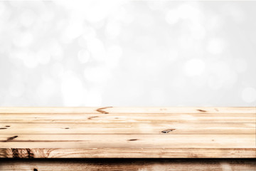 Wall Mural - empty wood table ready for your product display montage. abstract lights gray and white bokeh blurre