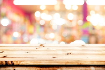 Wall Mural - empty wood table ready for your product display montage. lights bokeh blurred background