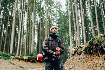 Wall Mural - caucasian male hiking in mountains