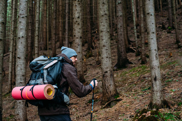 Wall Mural - caucasian male hiking in mountains