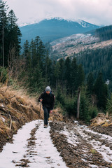 Wall Mural - caucasian male hiking in mountains