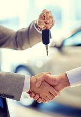 Wall Mural - close up of handshake in auto show or salon