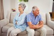 © WavebreakmediaMicro - Sad senior couple sitting on sofa