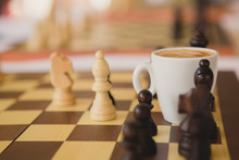 Leisure Relax Time Or Business Strategy Concept. Part Of Chess Table With Coffee Cup