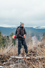 Wall Mural - caucasian male hiking in mountains