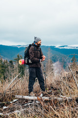 Wall Mural - caucasian male hiking in mountains