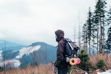 Wall Mural - caucasian male hiking in mountains