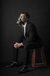 Virus Pandemic. Man dressed with a suit wtih a mask gas