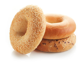 Fresh bagels on white background