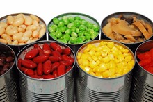Close Up Of Opened Cans Of Vegetables
