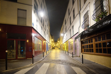 Wall Mural - Paris, France, February 9, 2016: view of a street in a center of Paris, France in a night