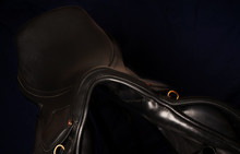 Black Leather Professional Saddle  At Black Background