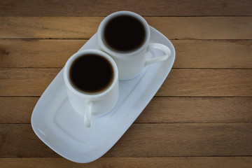 Tea 2 cup on a wooden table.