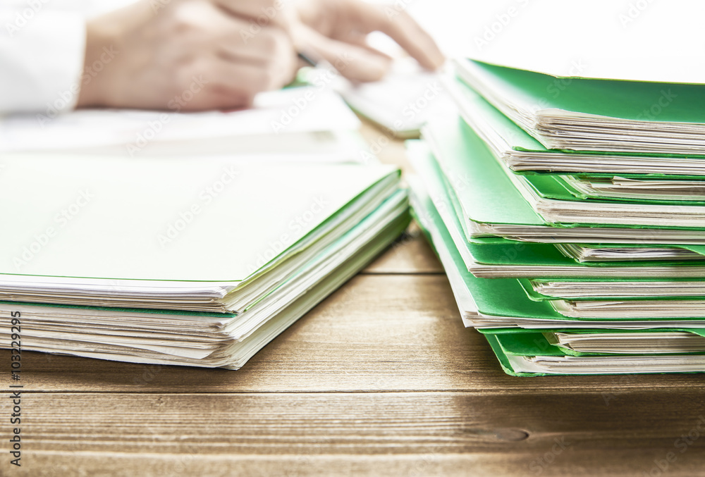 Filing On Table Office desk table with files. Stock Photo | Adobe Stock