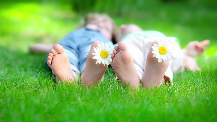 Sticker - Friends lying on grass outdoors in spring park