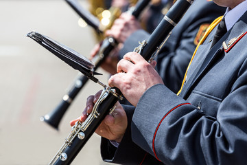 Wall Mural - musicians in the military orchestra playing on clarinet