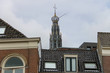 The bell tower of the Grote Kerk (Sint-Bavokerk) over the roofs