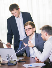 Wall Mural - cheerful smiling young businesspeople or business man and client working at office