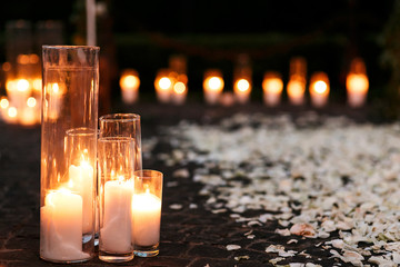 Fairytale romantic wedding aisle with white candles and petals i