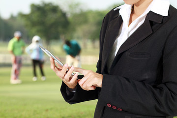 Businessmen and women are using mobile and touch smart phone on
