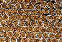 Heap Of Tobacco Cigarettes, Stack As A Background Texture, Close