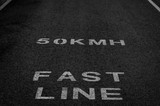 Fototapeta  - Speed limit written on the asphalt