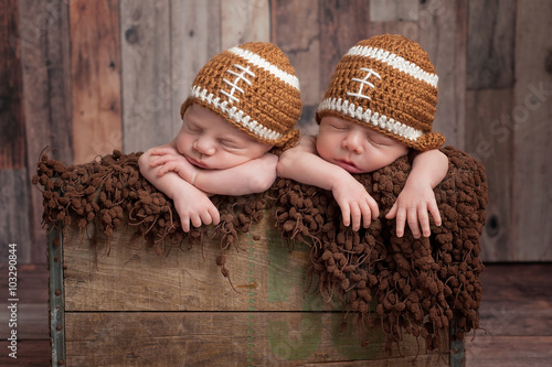 Fototapeta Twin Baby Boys Wearing Football Shaped Hats