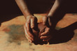 © ADDICTIVE STOCK - Close up of man's hand holding pottery clay
