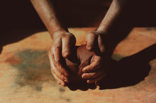 Close Up Of Man's Hand Holding Pottery Clay