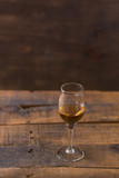 Fototapeta Lawenda - whiskey in glass on wood background