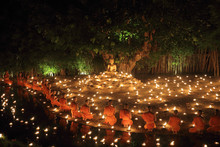 Buddhist Monks Sit Meditating Under A Bodhi Tree At The Wat Pan