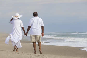 happy senior african american couple man woman on beach