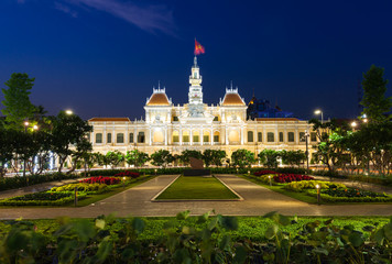 People are walking and taking pictures in front of the City Hall building, Ho Chi Minh City, Vietnam on February 14, 2016.