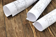 © georgimironi - Photo drawings for the project engineering work that lie on a wooden table