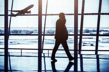 Wall Mural - Travelers silhouettes at airport,Beijing