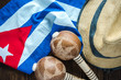 Cuban flag, panama hat and musical instrumet.