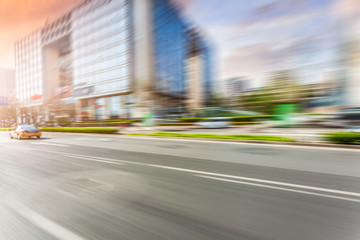 Wall Mural - Car driving on road, motion blur