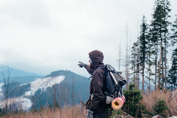 Wall Mural - caucasian male hiking in mountains