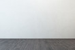 empty room with white wall and wooden floor