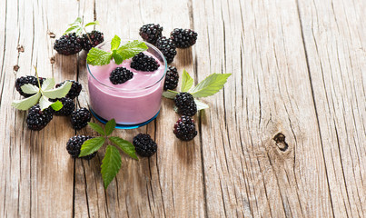 Wall Mural - Delicious berry yogurt with blackberries