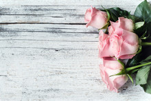 Beautiful Pink Roses On Wooden Background/ Holidays Romantic Background. Copy Space, Top View