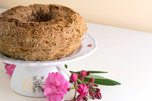 Bake Ring Cake With Icing Sugar, Decorated With Pink Flowers